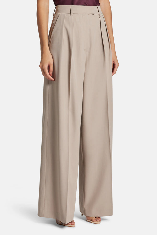 Lou High Waisted Flared Wool Trousers in Beige