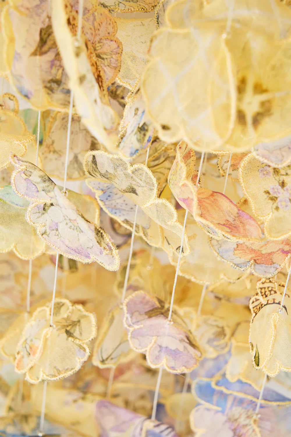 Darling Buds Floral Drawstring Silk Pouch Bag With Floral Fringes in Yellow